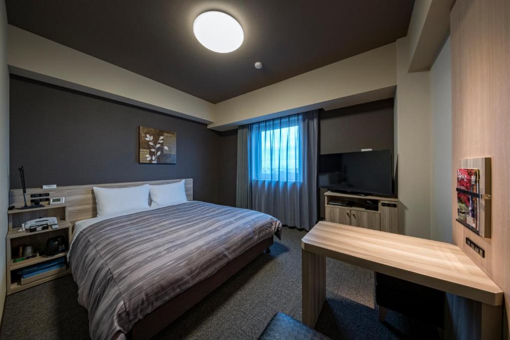 Postel nebo postele na pokoji v ubytování Hotel Route-Inn Kamisu