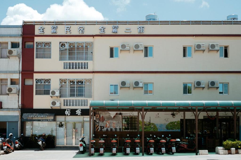 a building with writing on the side of it at Jin Lu Homestay in Jincheng