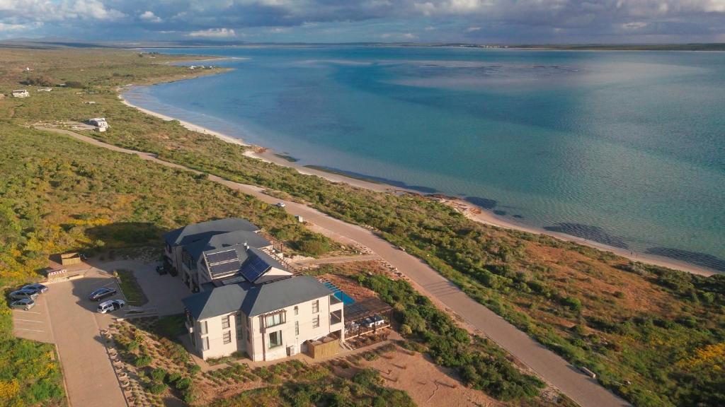 an aerial view of a house next to a beach at Shark Bay Hotel & Spa in Langebaan