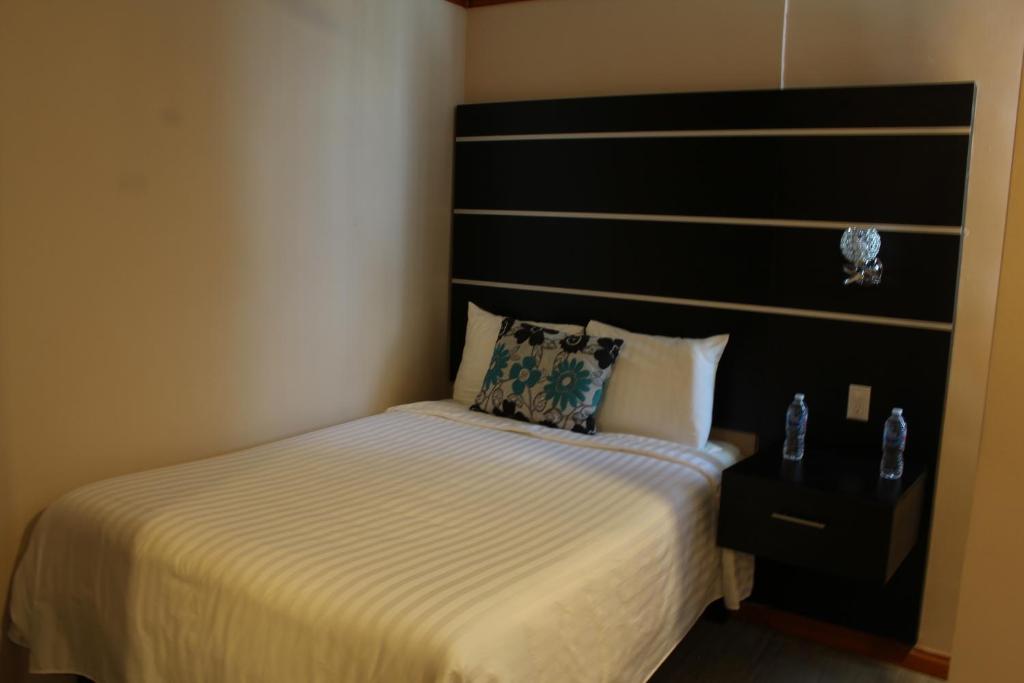 Postel nebo postele na pokoji v ubytování Hotel Cacaxtla