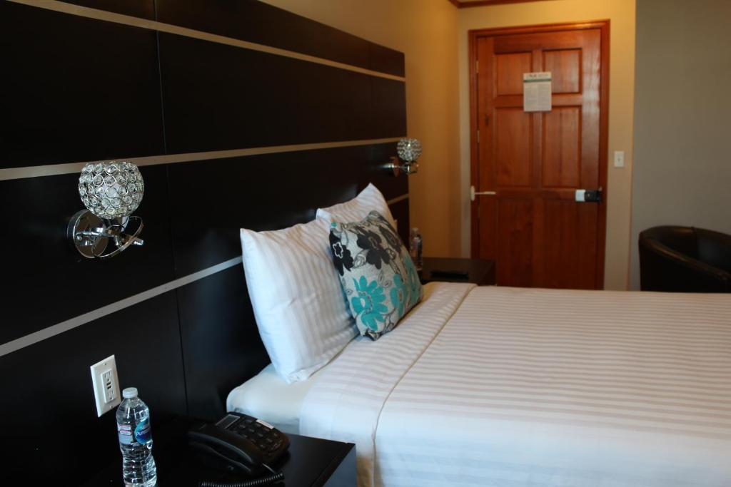 Postel nebo postele na pokoji v ubytování Hotel Cacaxtla