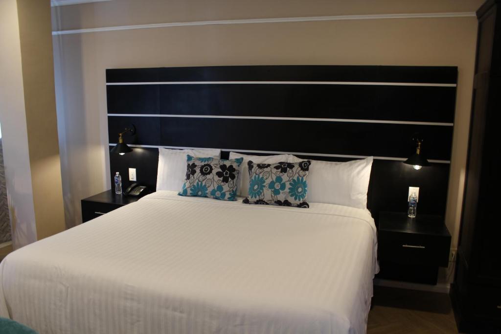 Postel nebo postele na pokoji v ubytování Hotel Cacaxtla