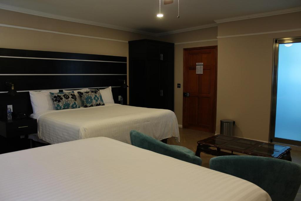 Postel nebo postele na pokoji v ubytování Hotel Cacaxtla