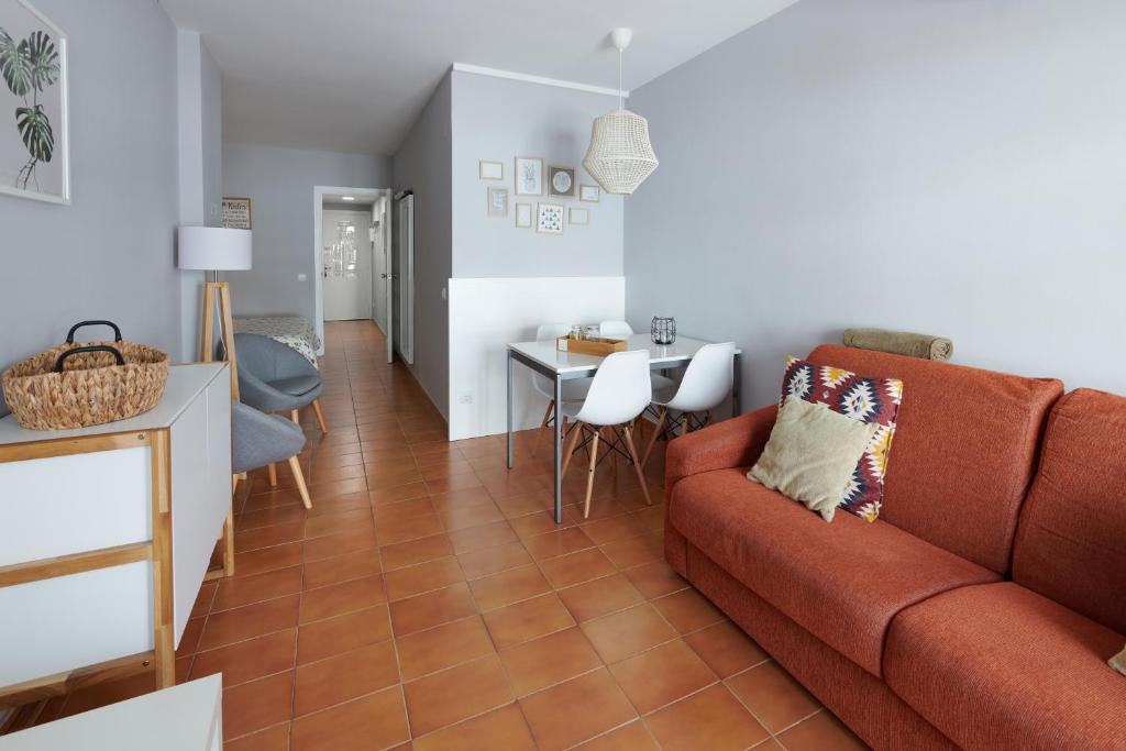 a living room with a couch and a table at Desconnectar Tossa de Mar in Tossa de Mar