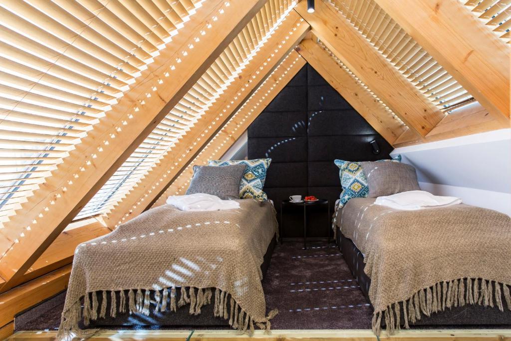 Posteľ alebo postele v izbe v ubytovaní VIP Apartamenty ROYAL SPA