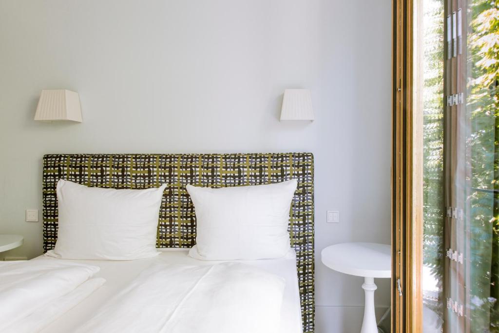 Postel nebo postele na pokoji v ubytování Jugend- und Familienhotel Augustin