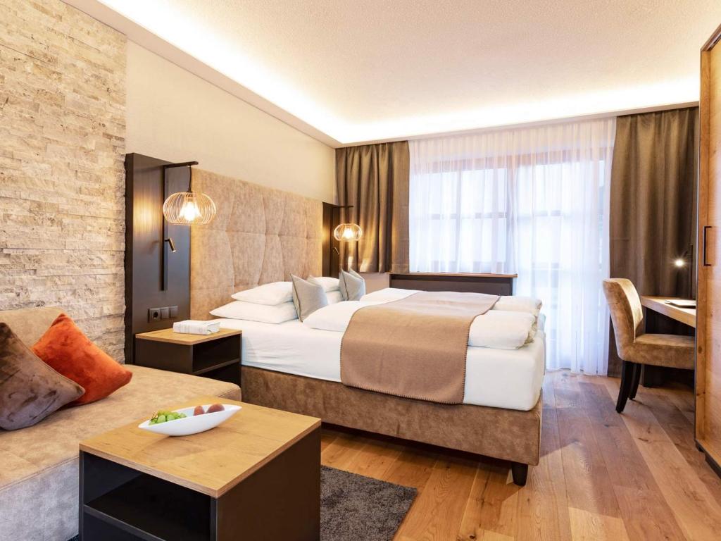Posteľ alebo postele v izbe v ubytovaní Seiblishof Superior Hotel Ischgl