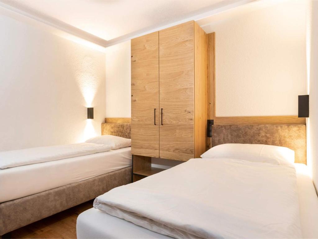 Posteľ alebo postele v izbe v ubytovaní Seiblishof Superior Hotel Ischgl