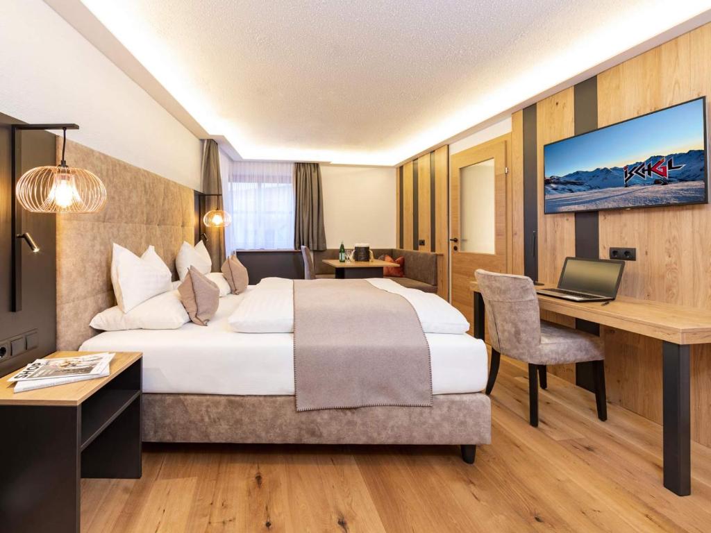 Posteľ alebo postele v izbe v ubytovaní Seiblishof Superior Hotel Ischgl