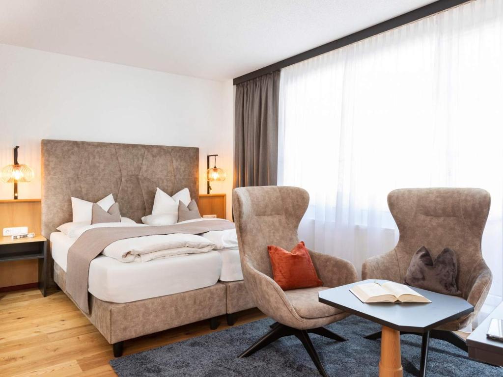 Posteľ alebo postele v izbe v ubytovaní Seiblishof Superior Hotel Ischgl