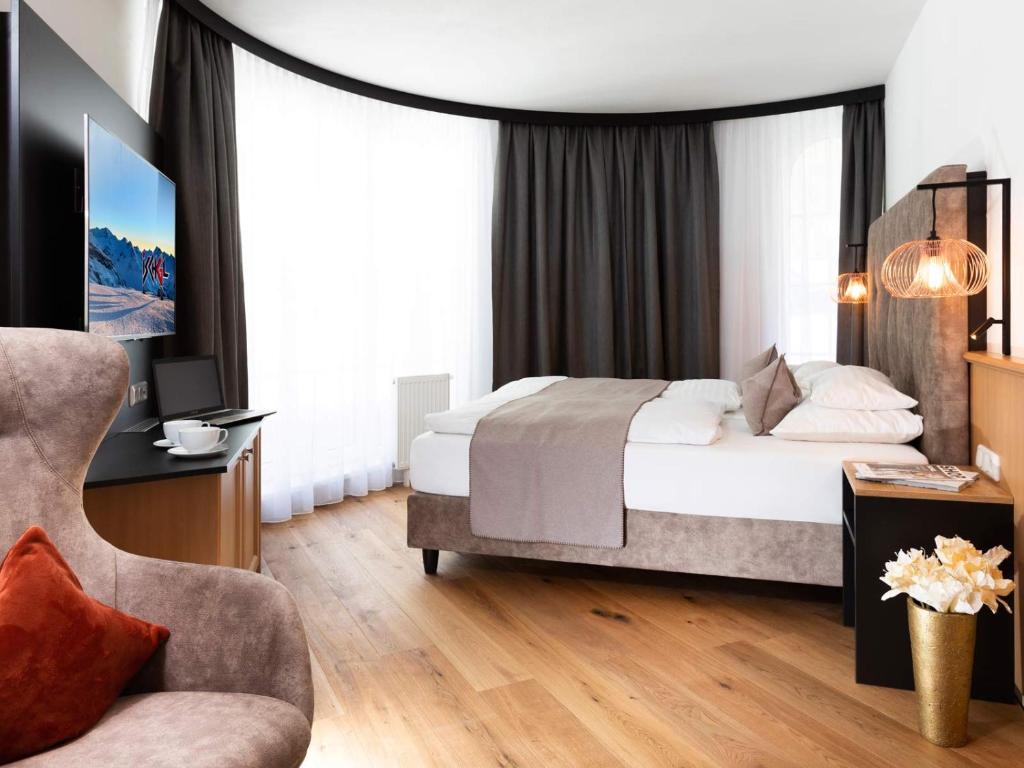 Posteľ alebo postele v izbe v ubytovaní Seiblishof Superior Hotel Ischgl