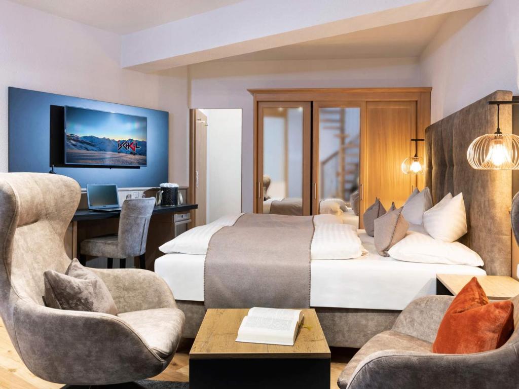 Posteľ alebo postele v izbe v ubytovaní Seiblishof Superior Hotel Ischgl