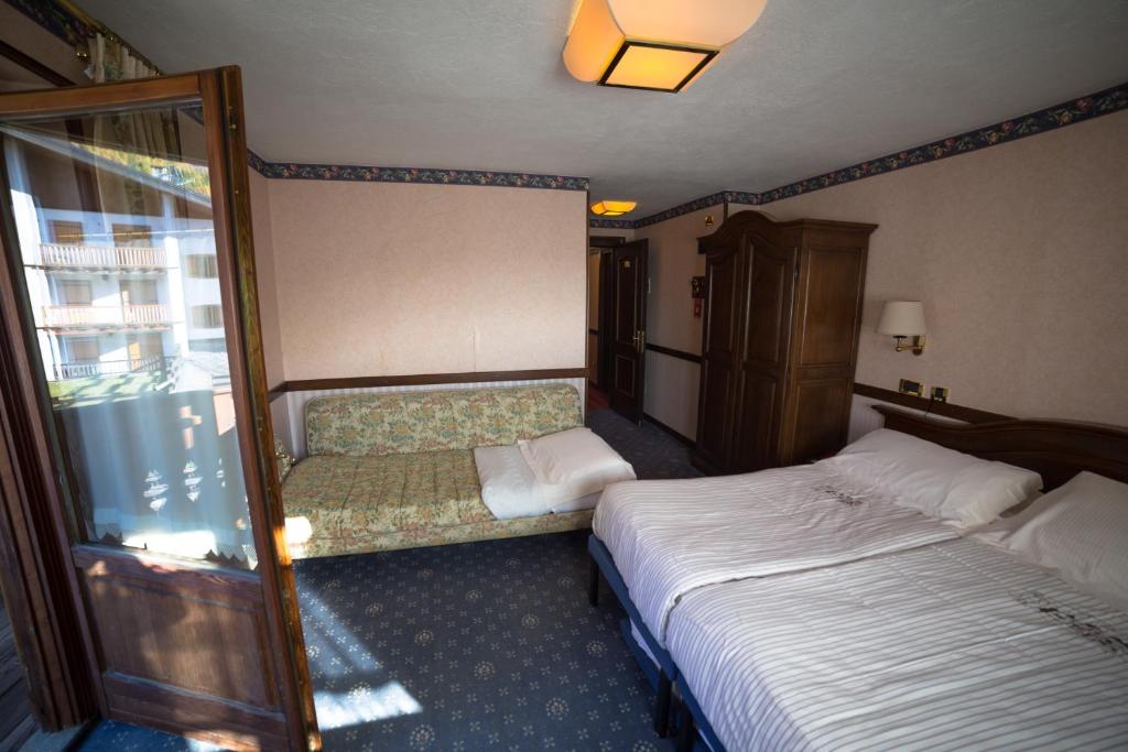 Postel nebo postele na pokoji v ubytování Hotel Petit Prince