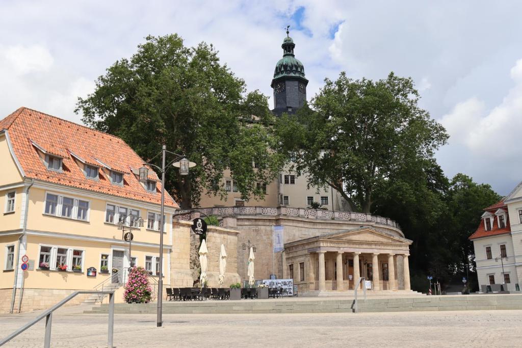 a building with a clock tower on top of it at Wohnen am Schloss, Schlossblick in Sondershausen