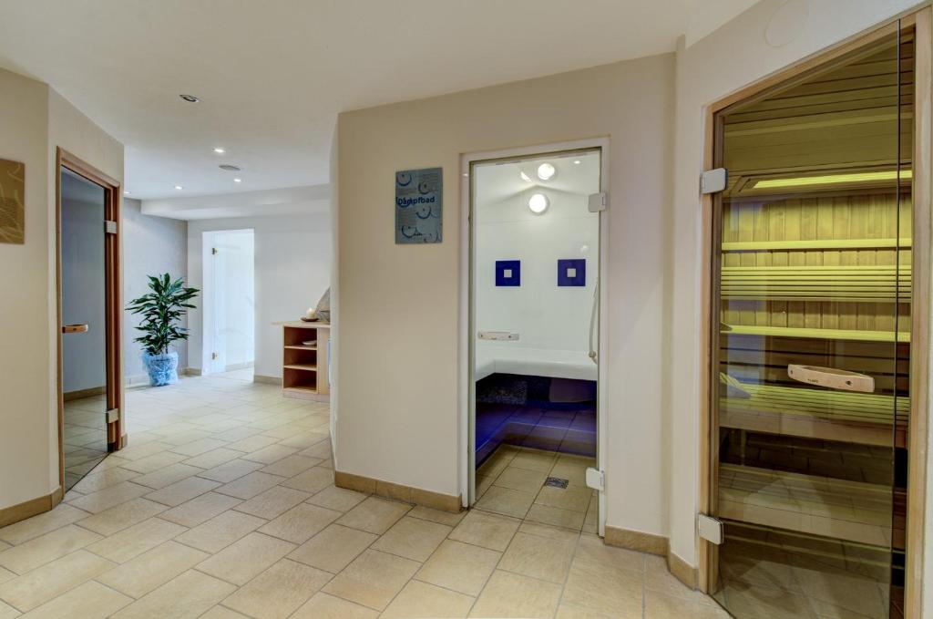 Postel nebo postele na pokoji v ubytování Berghotel Jaga-Alm