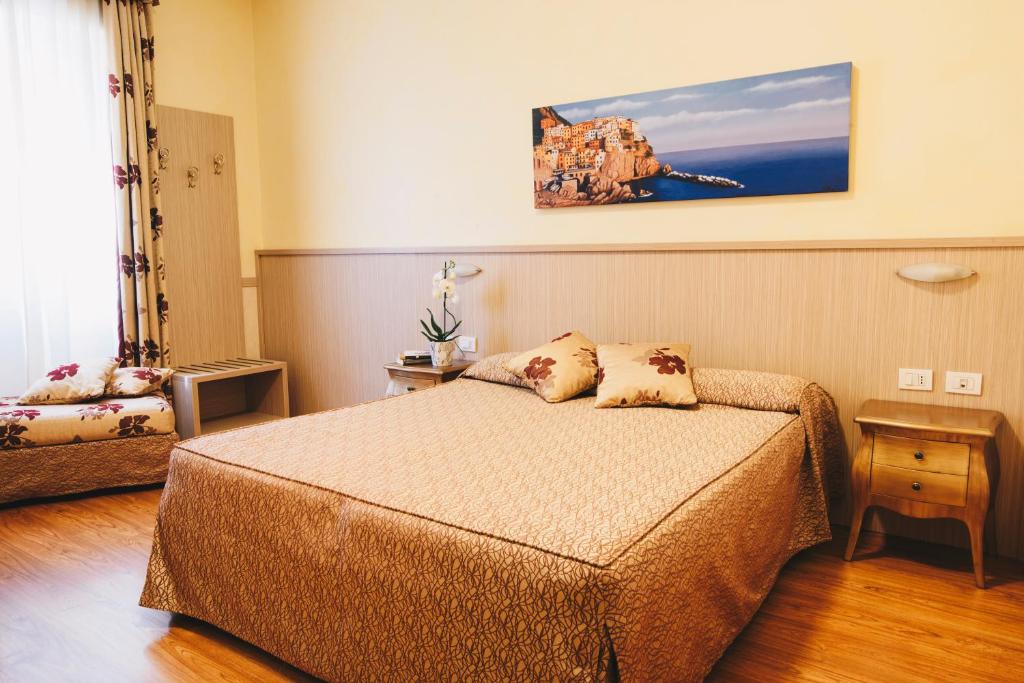 Postel nebo postele na pokoji v ubytování Hotel Corallo