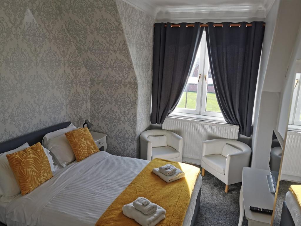 Postel nebo postele na pokoji v ubytování Brig O'Doon Guest House