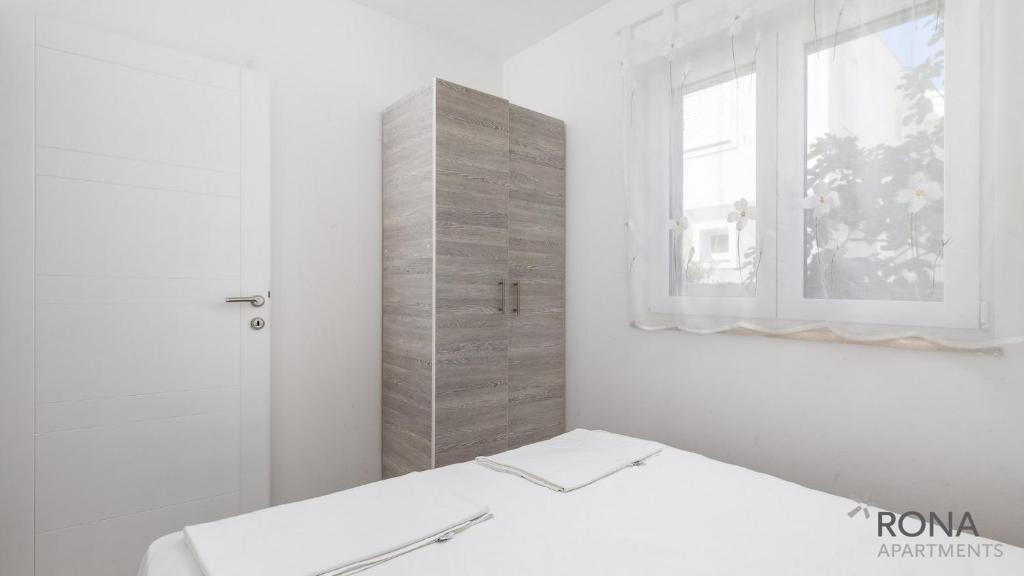 Postel nebo postele na pokoji v ubytování Rona Apartments Zlatko