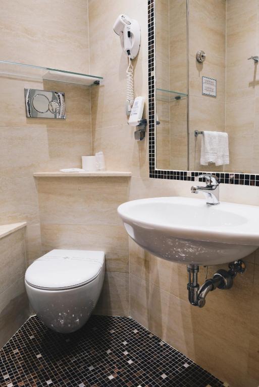 Koupelna v ubytování Hotel Corallo