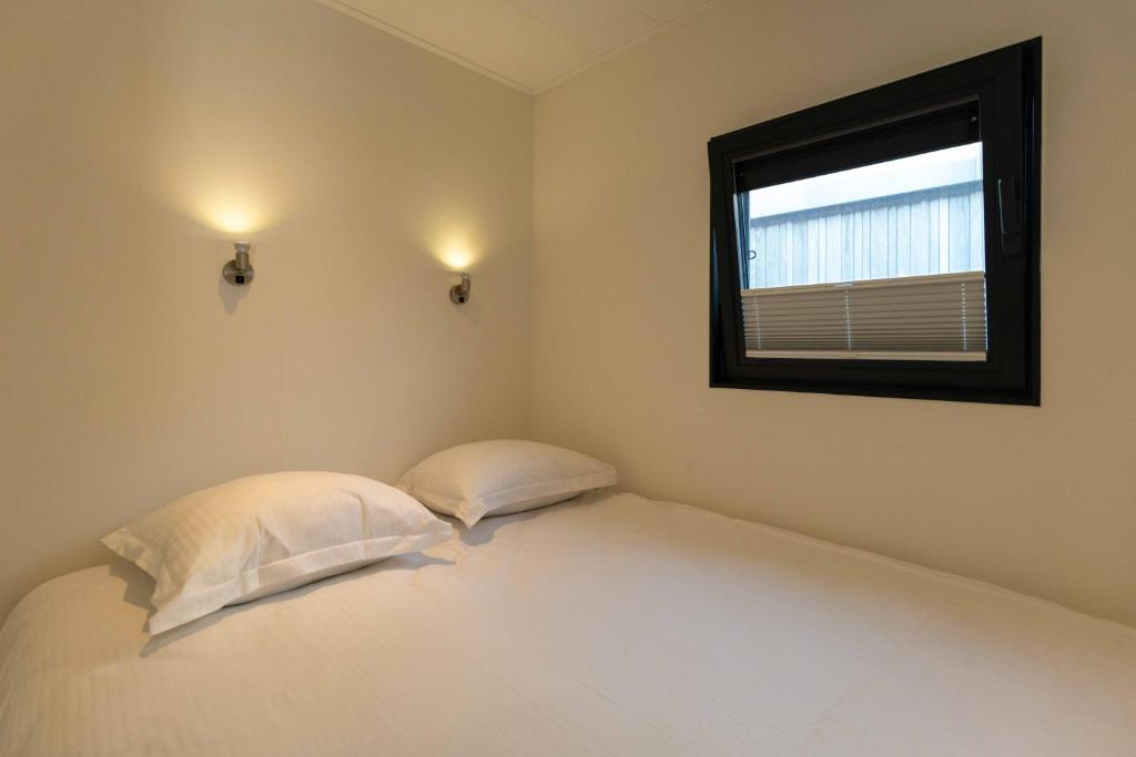 Postel nebo postele na pokoji v ubytování Houseboat-Oostende