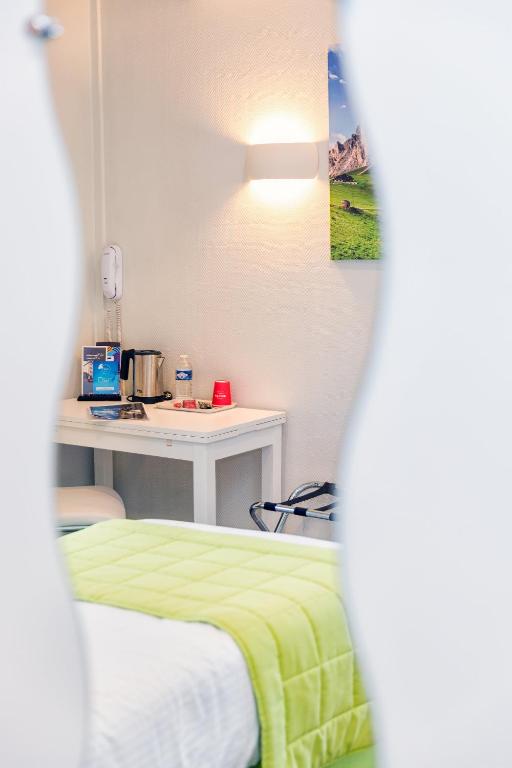 Postel nebo postele na pokoji v ubytování La Commanderie de Champarey