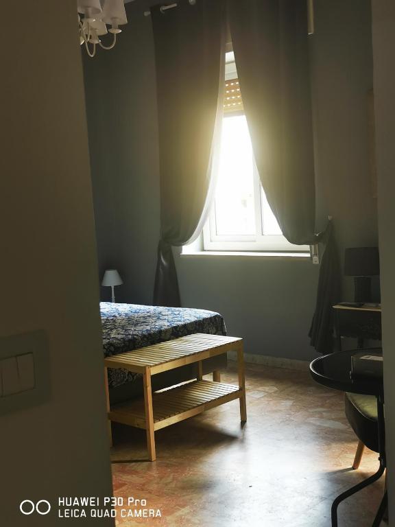 Postel nebo postele na pokoji v ubytování L'ARENA ROOM
