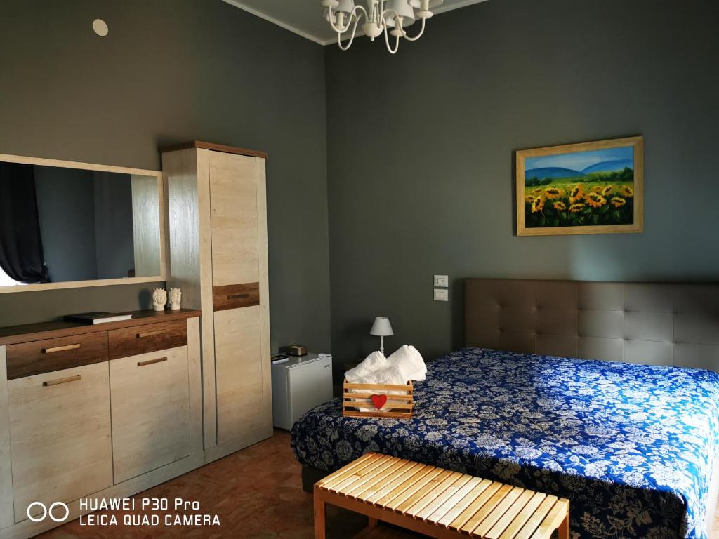 Postel nebo postele na pokoji v ubytování L'ARENA ROOM