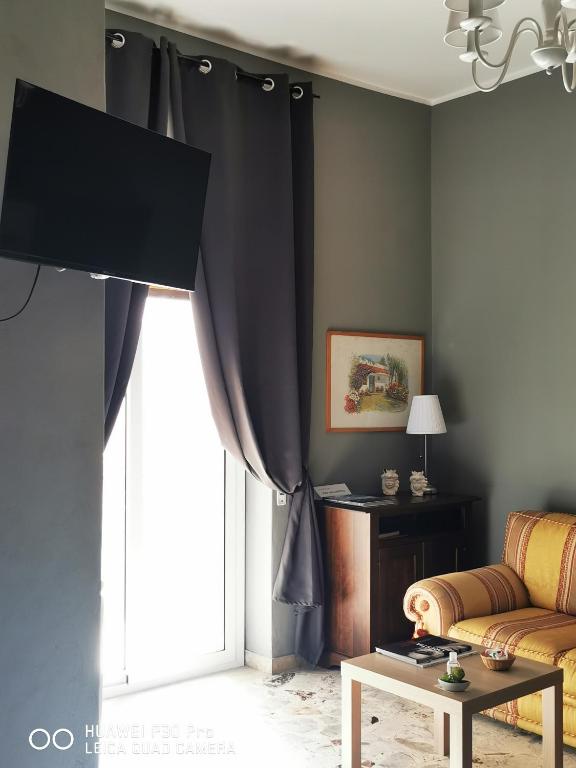 TV a/nebo společenská místnost v ubytování L'ARENA ROOM