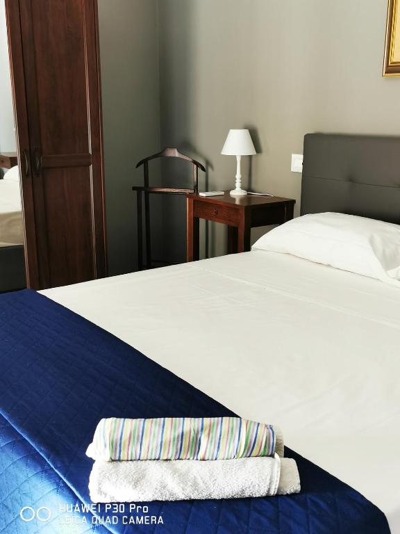 Postel nebo postele na pokoji v ubytování L'ARENA ROOM