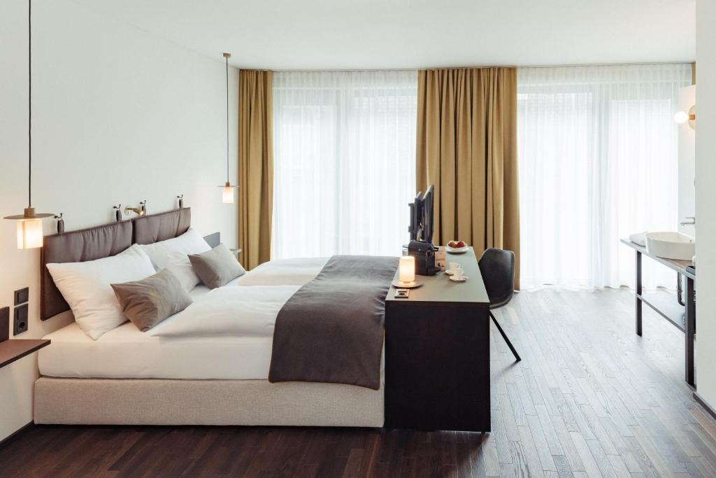 Postel nebo postele na pokoji v ubytování Boutique Hotel das TSCHOFEN