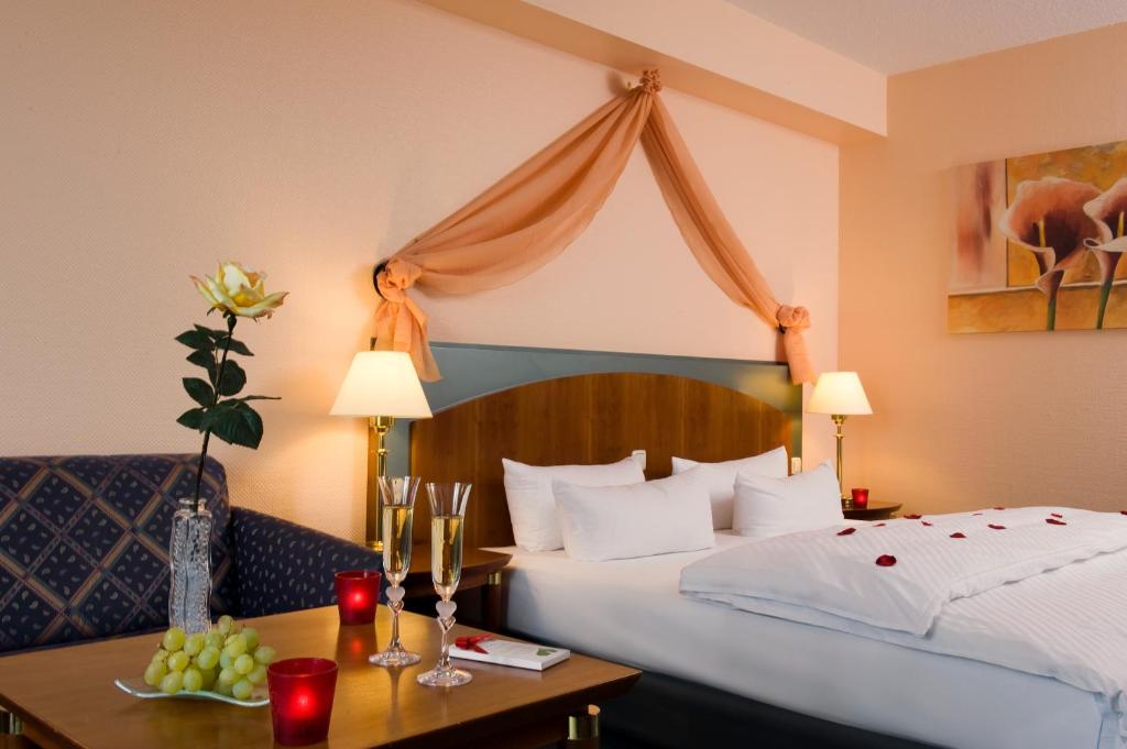 Letto o letti in una camera di Congress Hotel Weimar by Mercure