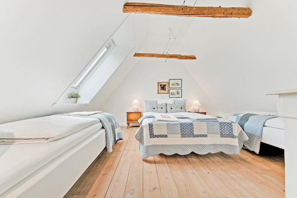 Postel nebo postele na pokoji v ubytování Åløkke BnB