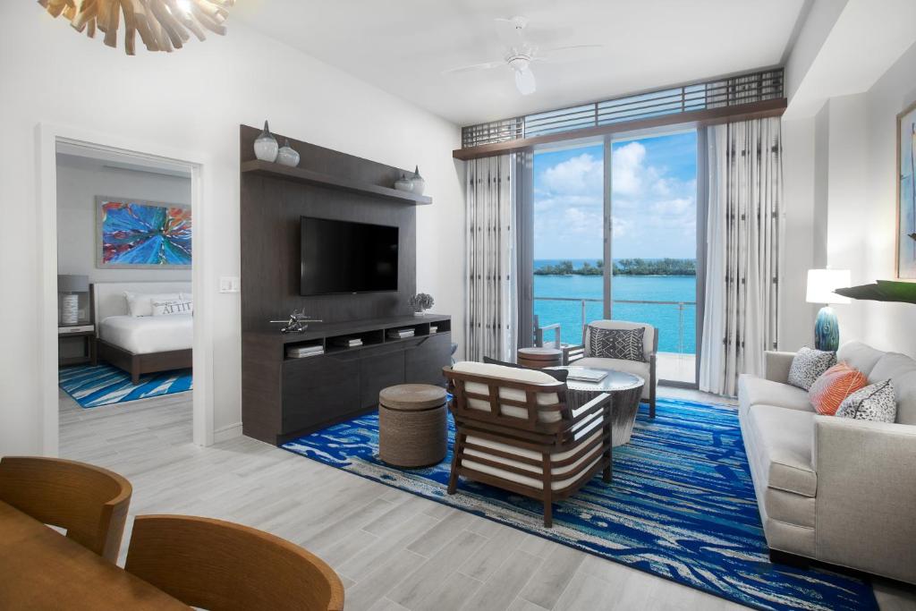 a living room with a view of the ocean at Margaritaville Beach Resort Nassau in Nassau