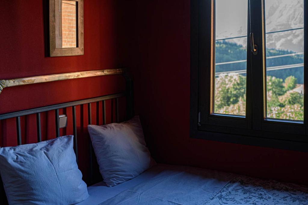Postel nebo postele na pokoji v ubytování Oikies Katogi