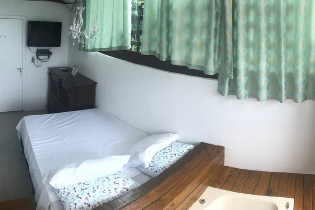 Katil atau katil-katil dalam bilik di 7. Apartamento com Banheira Vista Mar Bombinhas
