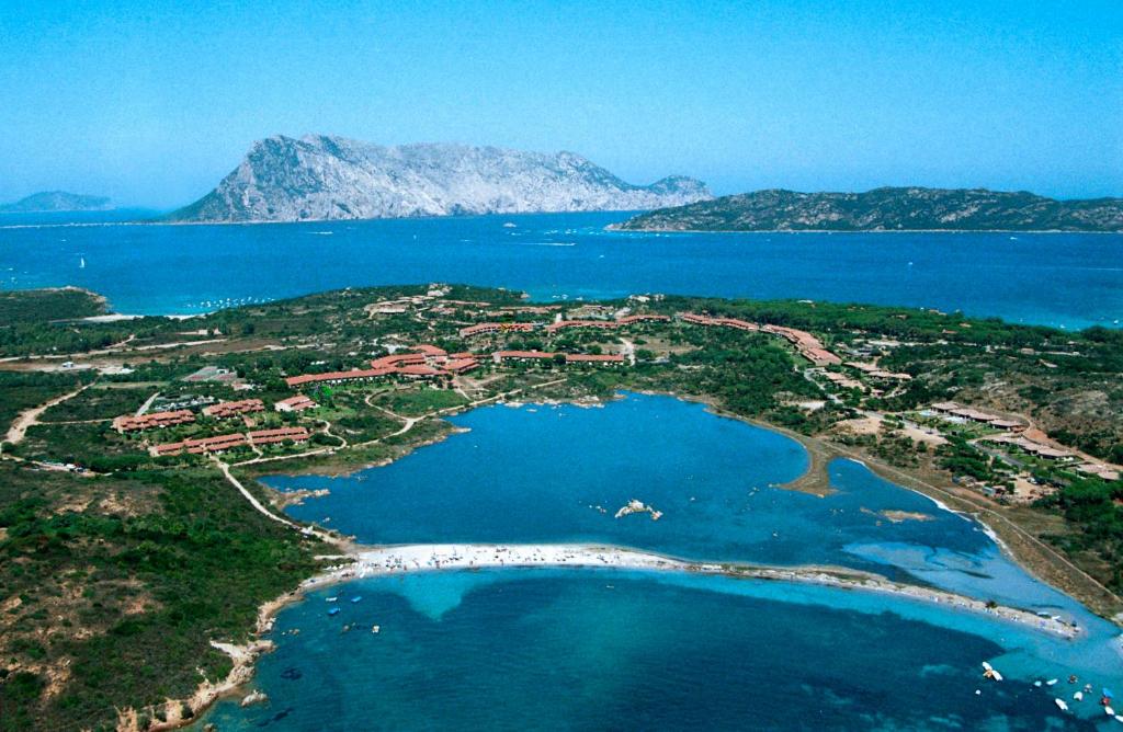an aerial view of a small island in the water at Residence Porto Coda Cavallo in San Teodoro