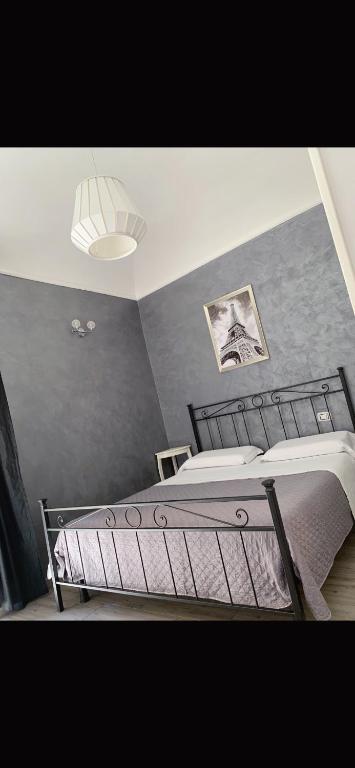 a bedroom with two beds and a ceiling at Babyface in Rome