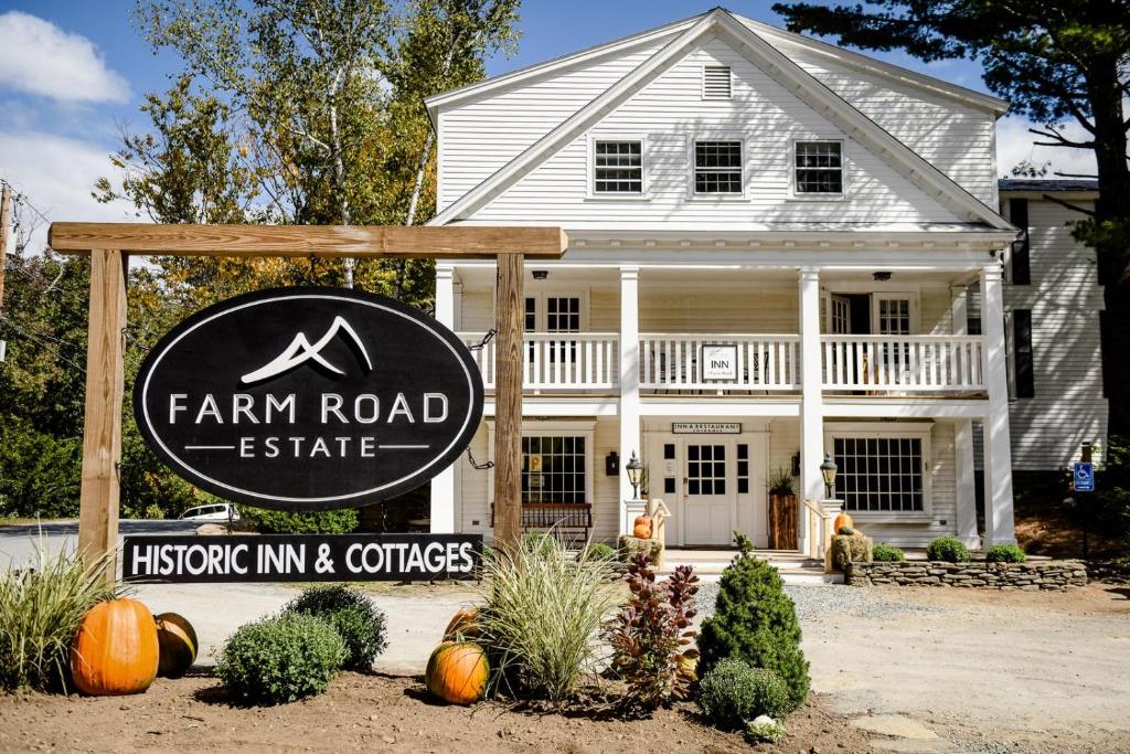 a farm road estate sign in front of a house at Farm Road Estate in West Dover