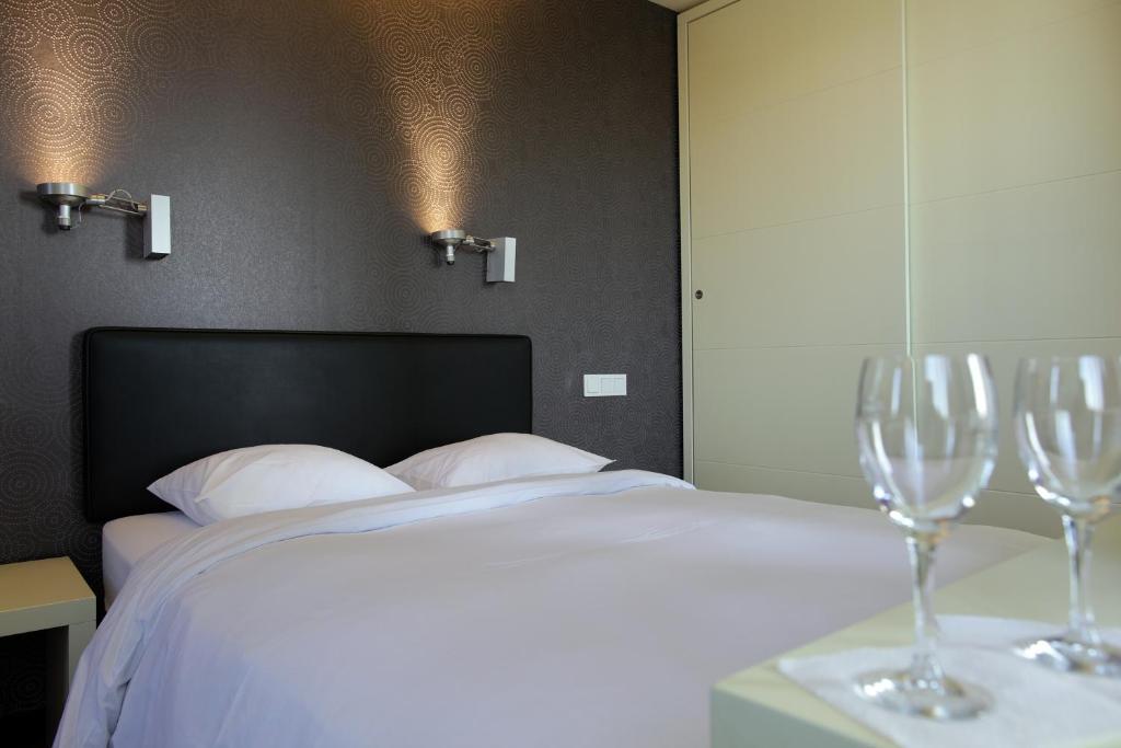 Voodi või voodid majutusasutuse Hotel Olivier toas