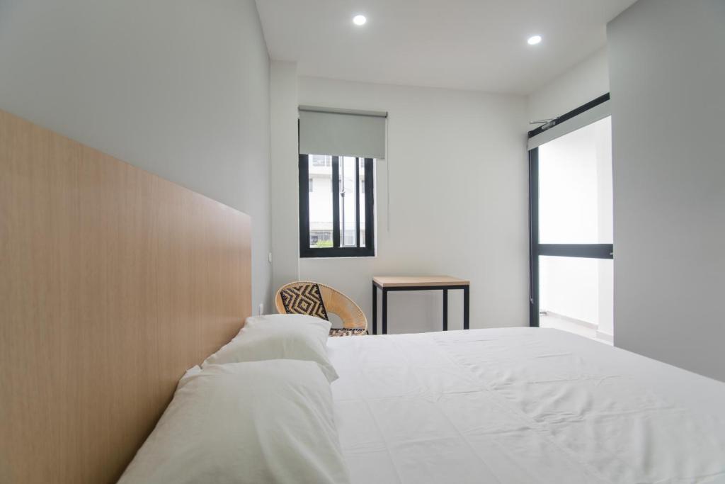 A bed or beds in a room at Stanza Hotel Sincelejo