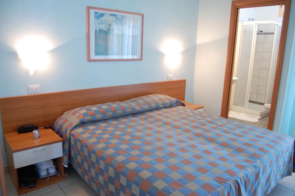 Postel nebo postele na pokoji v ubytování Hotel Iones