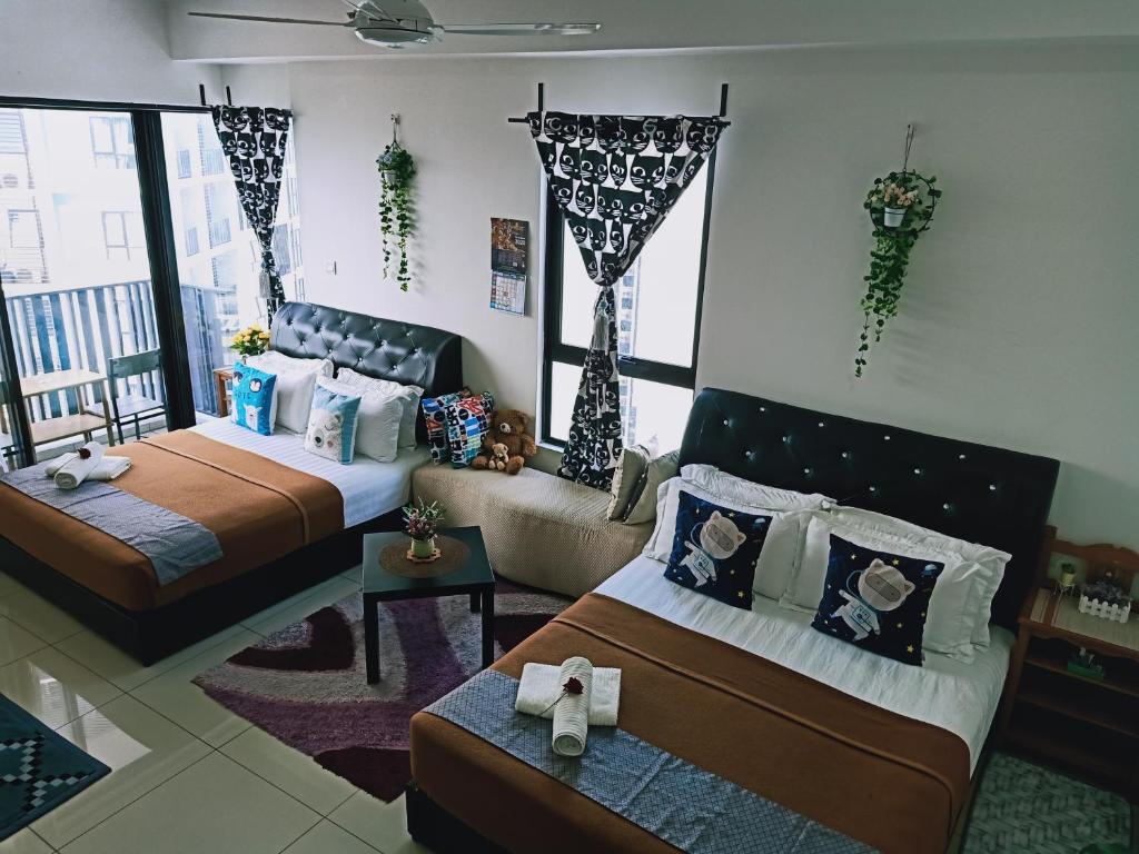 Postel nebo postele na pokoji v ubytování D'Gunduls Homestay STUDIO by DGH I-CITY