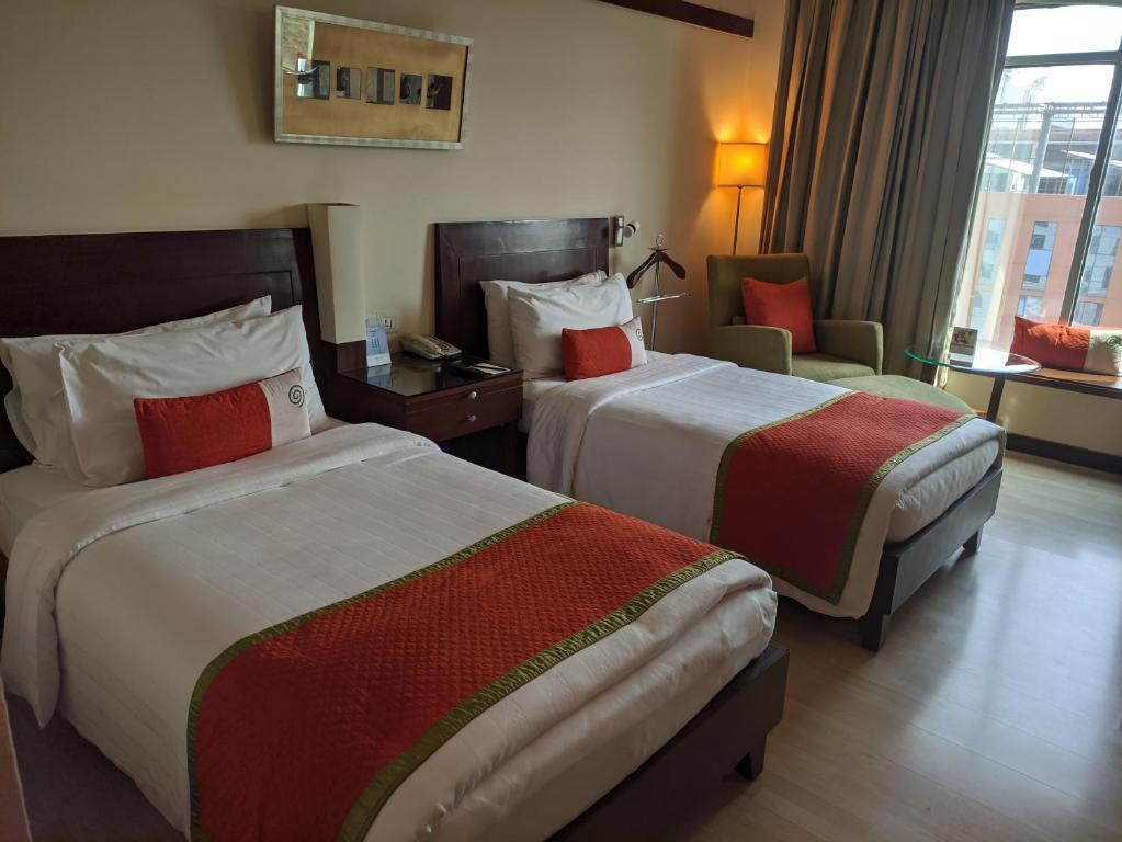 Postel nebo postele na pokoji v ubytování Fortune Select Global, Gurugram - Member ITC Hotels' Group