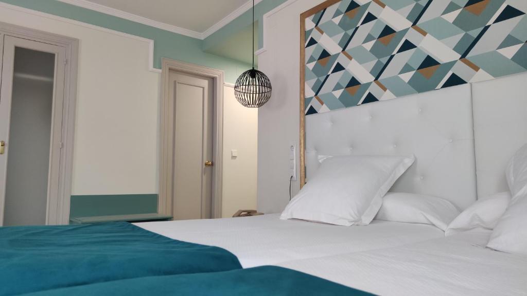 Posteľ alebo postele v izbe v ubytovaní Hotel Doña Blanca