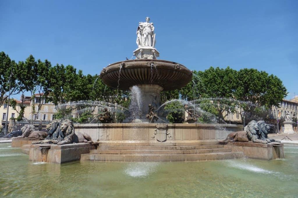 a fountain with two statues in the water at Villa Zola in Aix-en-Provence