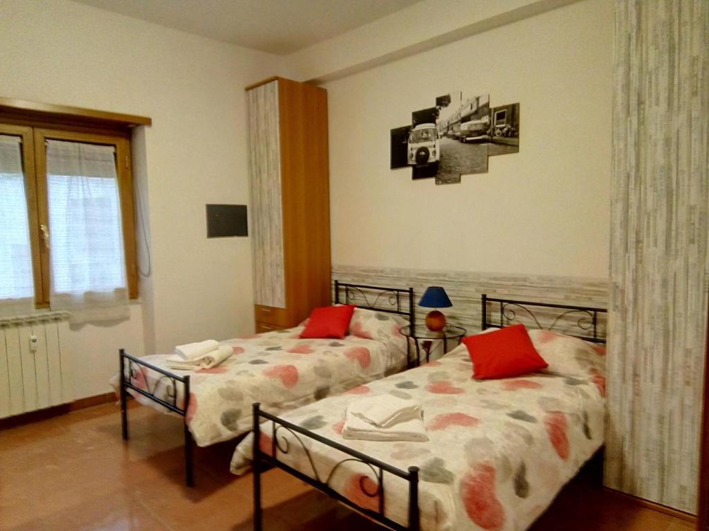 Łóżko lub łóżka w pokoju w obiekcie Suite art Pigneto