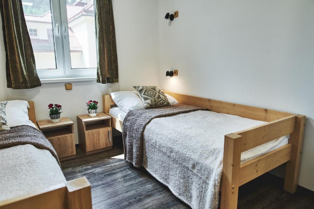 Postel nebo postele na pokoji v ubytování Stodola na Bílé