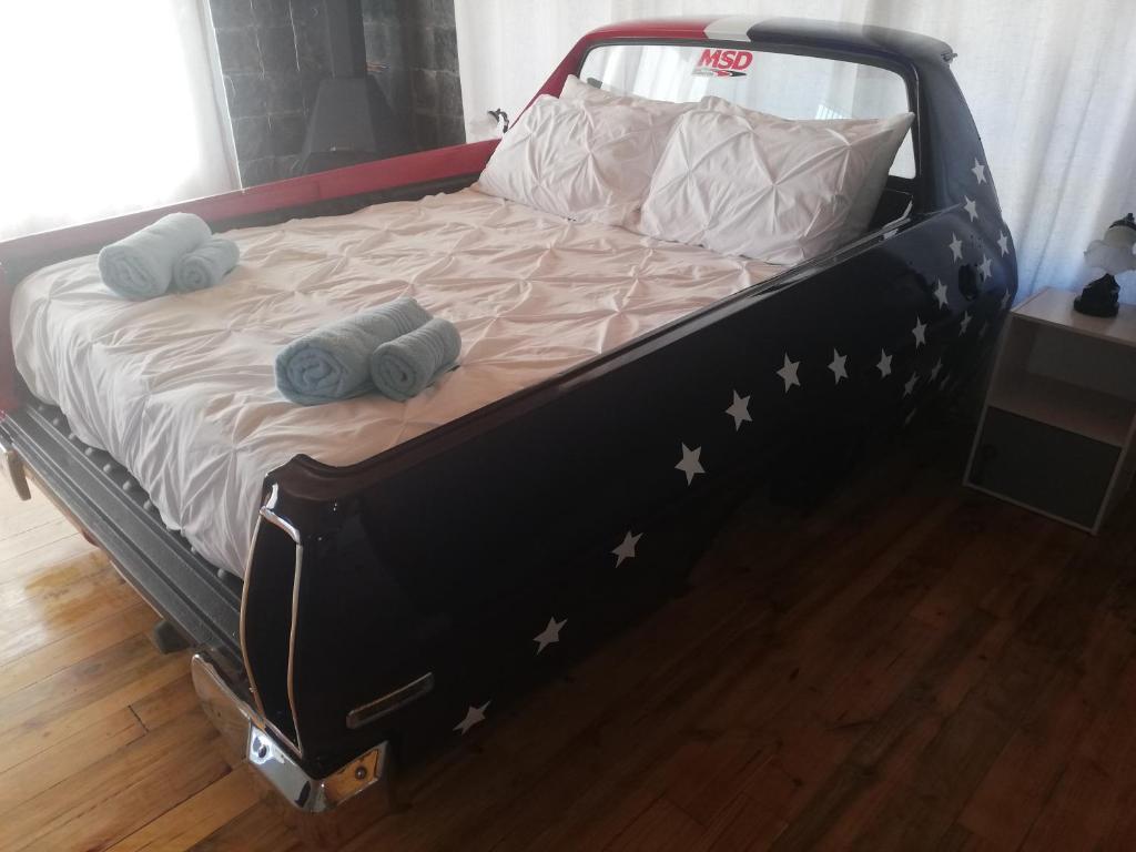 a bed with stars on it in a room at The V8 House in Sutherland