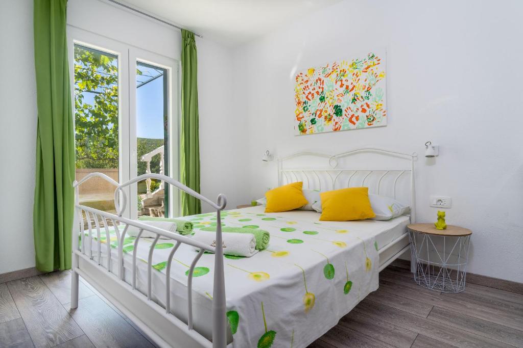 Posteľ alebo postele v izbe v ubytovaní House Simani
