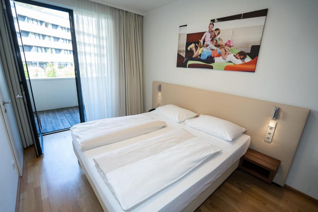 Postel nebo postele na pokoji v ubytování Appartementhaus Karawankenhof